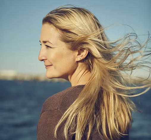 Coach Daina Behe by the ocean